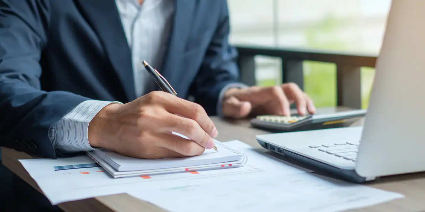 Cropped shot of a male accountant working with financial reports. Cropped shot of a male accountant working with financial reports.