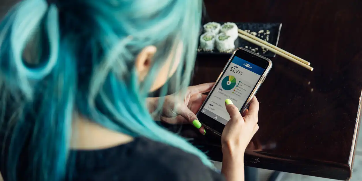 A woman checking her bank statement after receiving texts from your bank. A woman checking her bank statement after receiving texts from your bank.